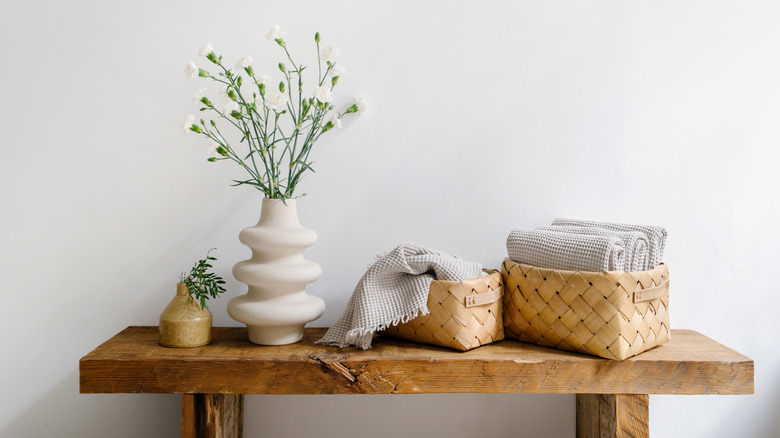 woven bathroom storage containers on table